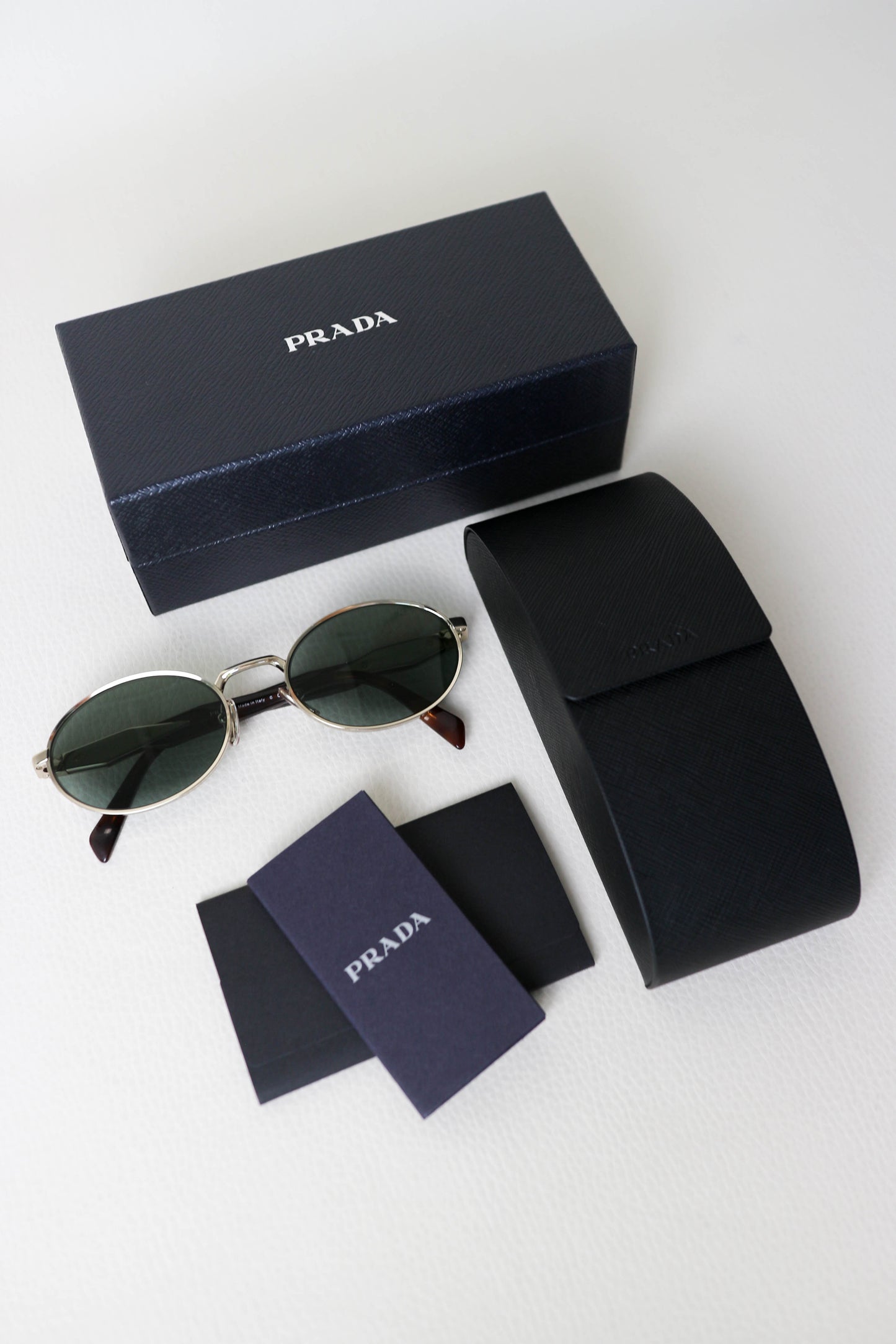 Prada Logo Oval Sunglasses Gold