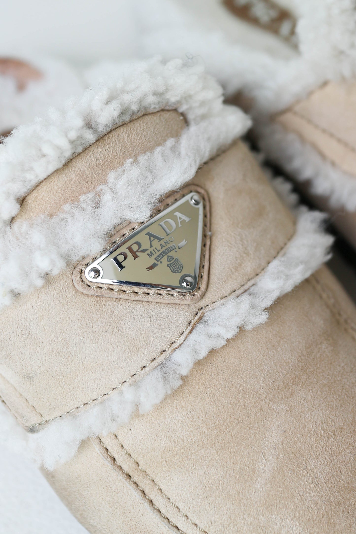 Prada Logo Shearling Mules Beige