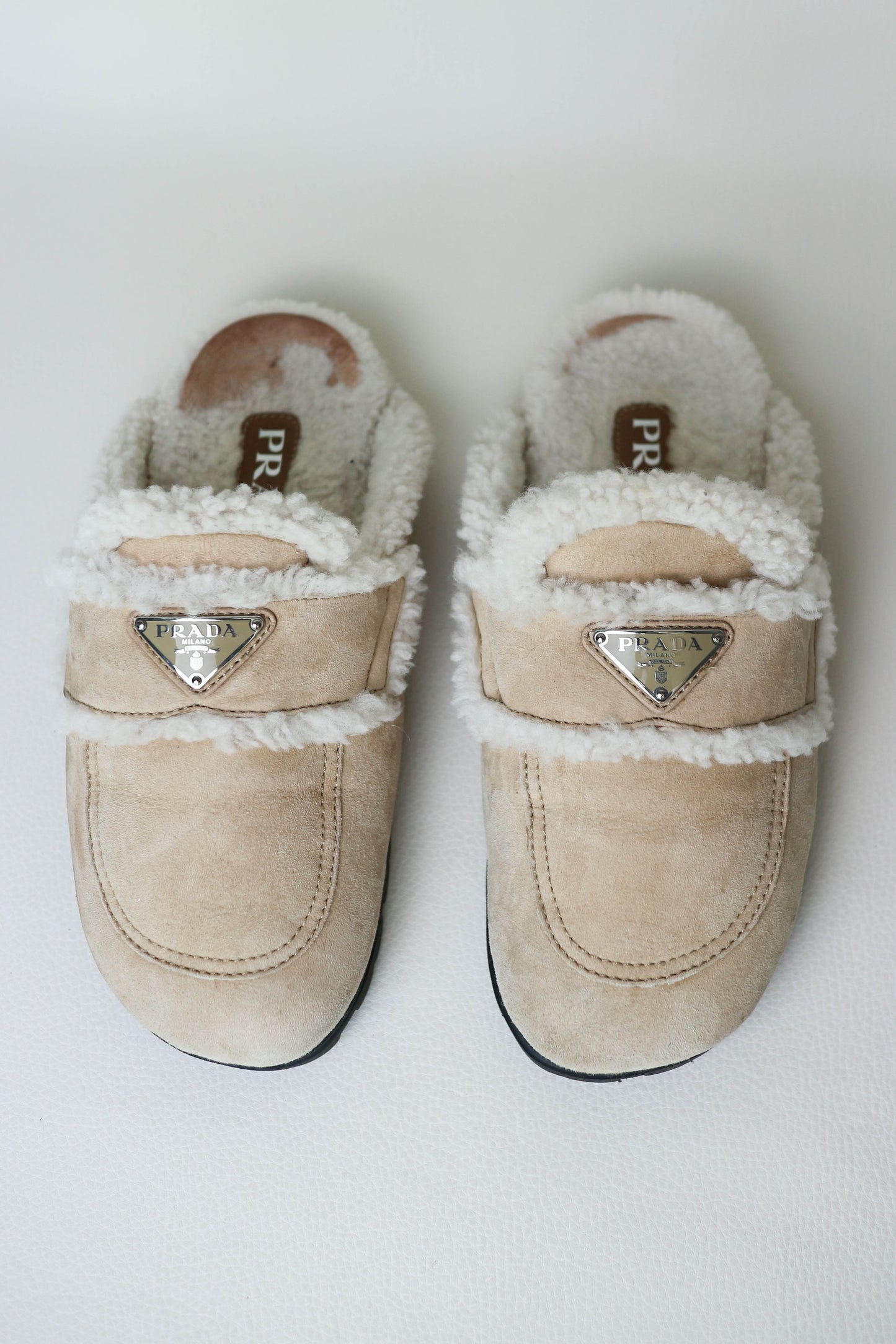 Prada Logo Shearling Mules Beige