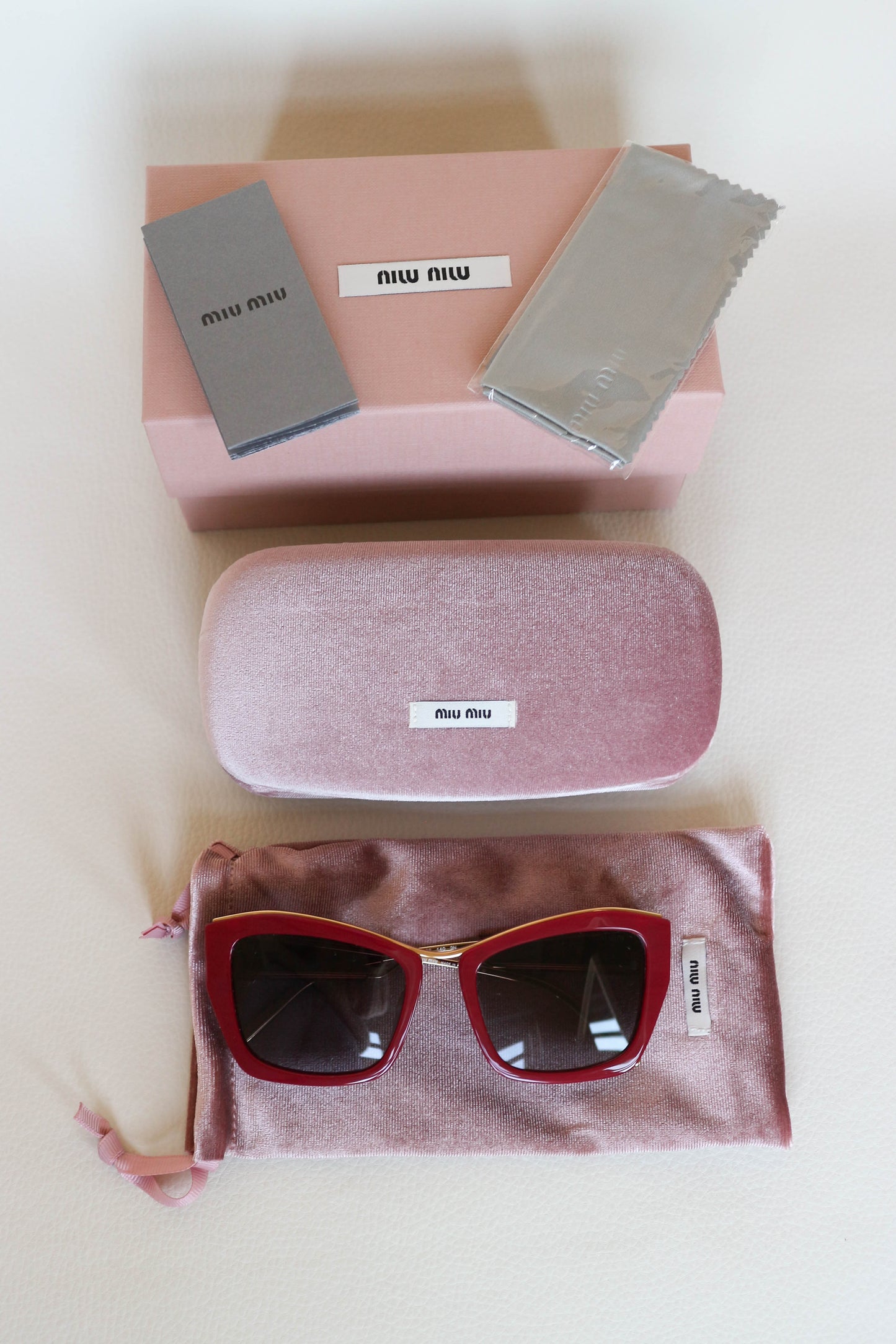 Miu Miu Cat Eye Sunglasses Red