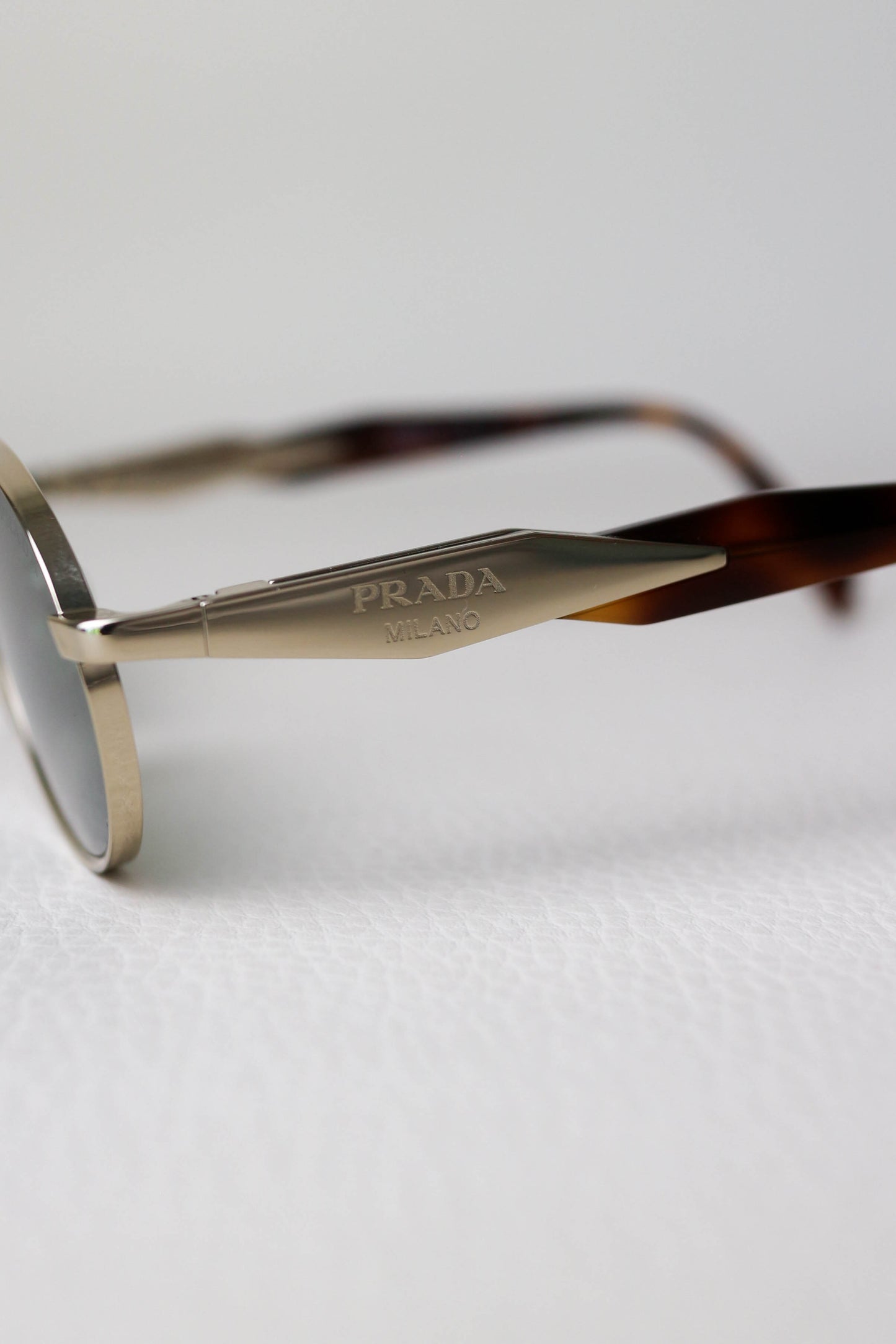 Prada Logo Oval Sunglasses Gold