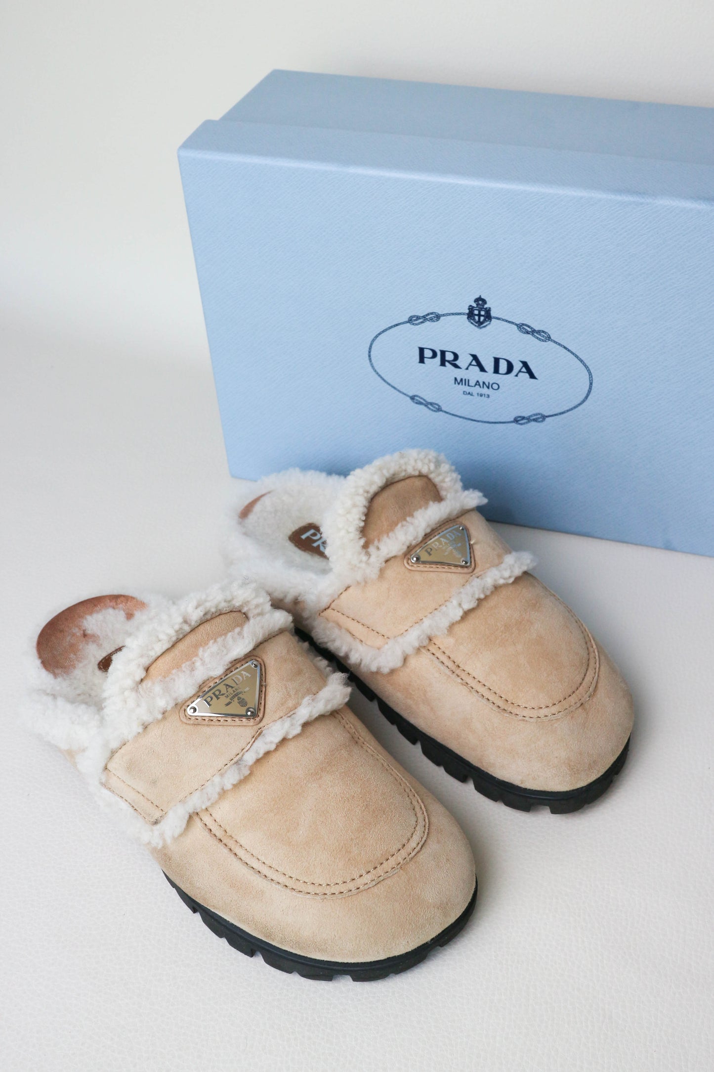 Prada Logo Shearling Mules Beige