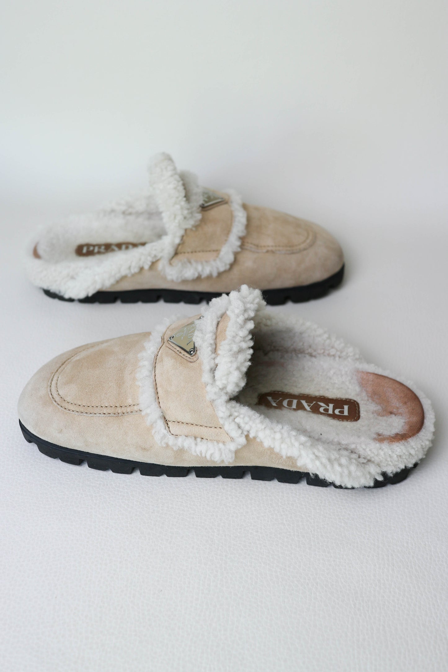 Prada Logo Shearling Mules Beige