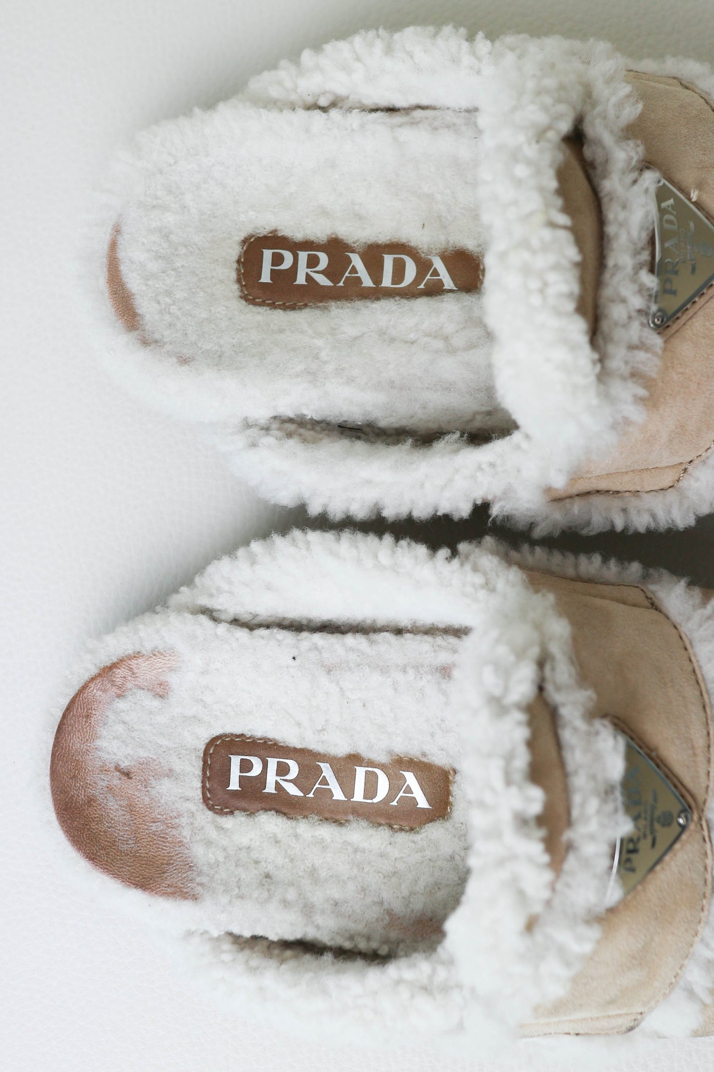 Prada Logo Shearling Mules Beige